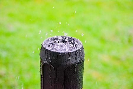 Rain drops of water are collected on the speaker